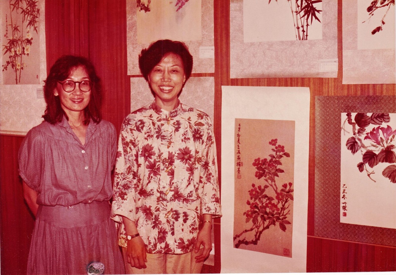 Wong Soo Yen beside her painting at Student Exhibit and classmate